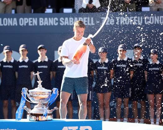 April 20, 2025, Sabadell, Barcelona, Spain: Barcelona Spain 20.04.2025 Holger Rune (Denmark) celebrates his victory with cava in the match between Carlos Alcaraz (Spain) and Holger Rune (Denmark) during the Day 7 of the Barcelona Open Banc Sabadell Godo on 20 April 2025 in Barcelona. Sabadell Spain - ZUMAu50_ 20250420_zsp_u50_151 Copyright: xXavixUrgelesx