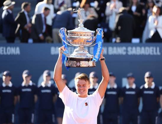 April 20, 2025, Sabadell, Barcelona, Spain: Barcelona Spain 20.04.2025 Holger Rune (Denmark) lifts the Barcelona Open title in the match between Carlos Alcaraz (Spain) and Holger Rune (Denmark) during the Day 7 of the Barcelona Open Banc Sabadell Godo on 20 April 2025 in Barcelona. Sabadell Spain - ZUMAu50_ 20250420_zsp_u50_166 Copyright: xXavixUrgelesx