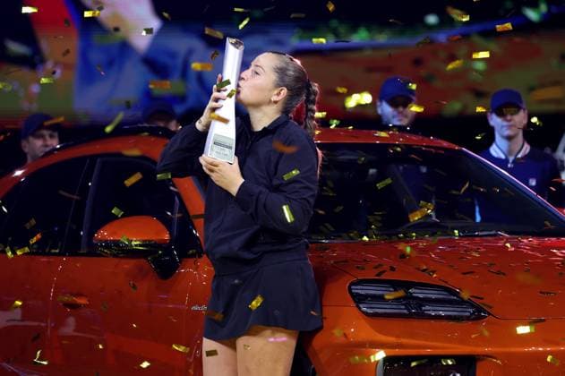 Stuttgart , Porsche Tennis Grand Prix Final, winner Jelena Ostapenko LAT celebrates her victory and kisses her trophy on the winning car Macan Turbo