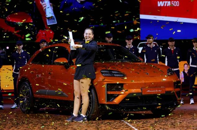 Stuttgart , Porsche Tennis Grand Prix Final, winner Jelena Ostapenko LAT celebrates her victory with trophy and winning car Macan Turbo