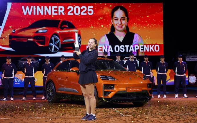 Stuttgart , Porsche Tennis Grand Prix Final, winner Jelena Ostapenko LAT with trophy in front of the winning car Macan Turbo