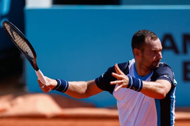 April 23, 2025, Madrid, Madrid, SPAIN: Roman Safiullin of Russia plays against Arthur Rinderknech of France during the Mutua Madrid Open 2025, ATP, Tennis Herren Masters 1000 and WTA, Tennis Damen 1000, tennis tournament celebrated at Caja Magica on April 23, 2025 in Madrid, Spain. Madrid SPAIN - ZUMAa181 20250423_zaa_a181_092 Copyright: xDennisxAgyemanx