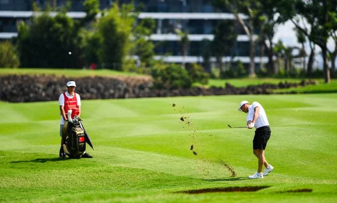 (250424) -- HAIKOU, April 24, 2025 -- Li Haotong of China hits his putt during the round 1 at the Hainan Classic golf tournament of the DP World Tour in Haikou, south China s Hainan Province, April 24, 2025. ) (SP)CHINA-HAIKOU-GOLF-DP WORLD TOUR-HAINAN CLASSIC-ROUND 1 (CN) YangxGuanyu 