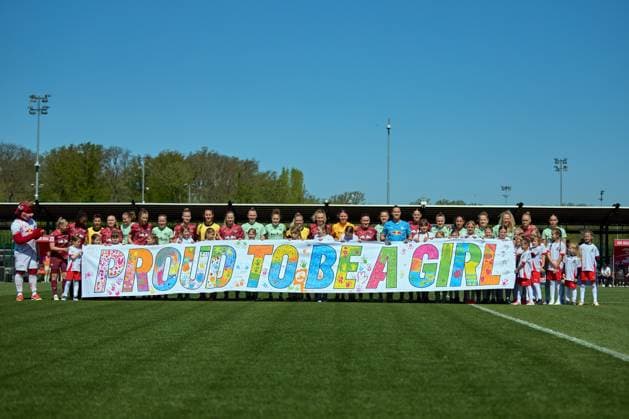 26 04 2025, GER, Womens soccer, BL, 2024 2025, RB Leipzig SGS Essen Teams and run-in children with banner Proud to be a girl before kick-off Leipzig training center of the Red Bull Saxony Germany