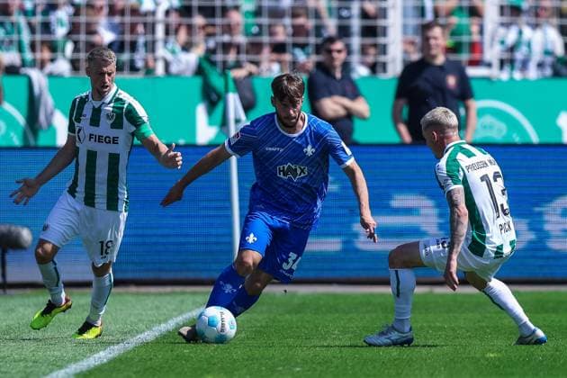 Soccer 2 Bundesliga 31 Matchday SC Preußen Münster SV Darmstadt 98 on 26 04 2025 at LVM Preußenstadion in Münster Marc Lorenz Münster , left Killian Corredor Darmstadt , center Florian Pick Münster , right DFL regulations prohibit any use of photographs as image sequences and or quasi video xJRx