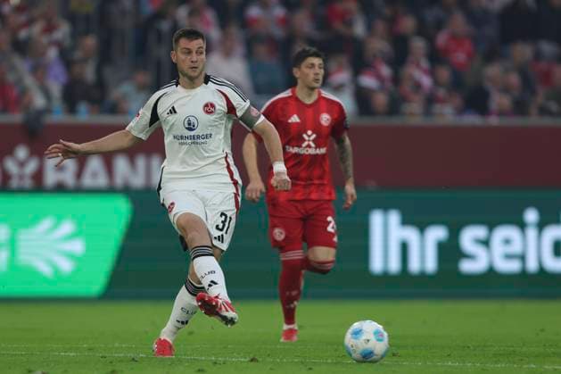 Robin Knoche 1 FC Nürnberg in action, on the ball, single action during the 2 Bundesliga match between Fortuna Düsseldorf and 1 FC Nürnberg at Merkur Spiel Arena on April 26, 2025 in Düsseldorf, Germany Germany Photo by Oliver Kaelke DeFodi Images Robin Knoche 1 FC Nürnberg controls the ball during the 2 Bundesliga match between Fortuna Düsseldorf and 1 FC Nürnberg at Merkur Spiel Arena on April 26, 2025 in Düsseldorf, Germany Photo by Oliver Kaelke DeFodi Images DFB DFL REGULATIONS PROHIBIT ANY USE OF PHOTOGRAPHS AS IMAGE SEQUENCES AND OR QUASI VIDEO Photo by Oliver Kaelke DeFodi Images