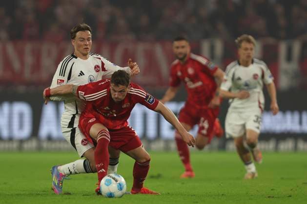 Caspar Jander 1 FC Nürnberg and Moritz Heyer Fortuna Duesseldorf battle for the ball during the 2 Bundesliga match between Fortuna Düsseldorf and 1 FC Nürnberg at Merkur Spiel Arena on April 26, 2025 in Düsseldorf, Germany, Germany Photo by Oliver Kaelke DeFodi Images Caspar Jander 1 FC Nürnberg and Moritz Heyer Fortuna Duesseldorf battle for the ball during the 2 Bundesliga match between Fortuna Düsseldorf and 1 FC Nürnberg at Merkur Spiel Arena on April 26, 2025 in Düsseldorf, Germany Photo by Oliver Kaelke DeFodi Images DFB DFL REGULATIONS PROHIBIT ANY USE OF PHOTOGRAPHS AS IMAGE SEQUENCES AND OR QUASI VIDEO Photo by Oliver Kaelke DeFodi Images