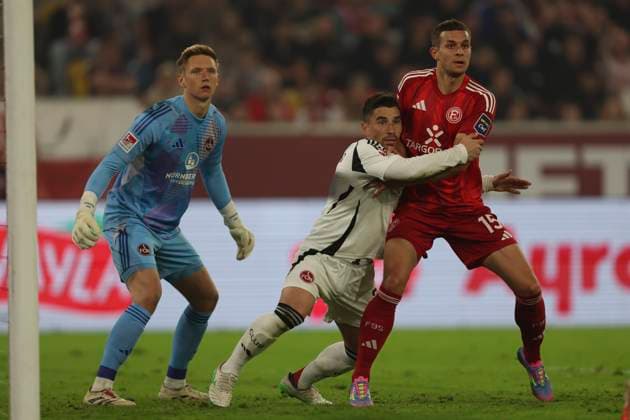 Goalkeeper Jan Reichert 1 FC Nürnberg , Mahir Emreli 1 FC Nürnberg and Tim Oberdorf Fortuna Duesseldorf battle for the ball during the 2 Bundesliga match between Fortuna Düsseldorf and 1 FC Nürnberg at Merkur Spiel Arena on April 26, 2025 in Düsseldorf, Germany Photo by Oliver Kaelke DeFodi Images Goalkeeper Jan Reichert 1 FC Nürnberg , Mahir Emreli 1 FC Nürnberg and Tim Oberdorf Fortuna Duesseldorf battle for the ball during the 2 Bundesliga match between Fortuna Düsseldorf and 1 FC Nürnberg at Merkur Spiel Arena on April 26, 2025 in Düsseldorf, Germany Photo by Oliver Kaelke DeFodi Images DFB DFL REGULATIONS PROHIBIT ANY USE OF PHOTOGRAPHS AS IMAGE SEQUENCES AND OR QUASI VIDEO Photo by Oliver Kaelke DeFodi Images
