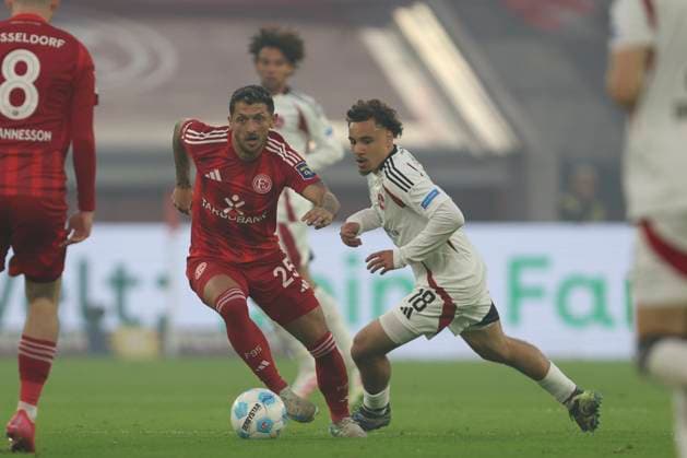 Matthias Zimmermann Fortuna Duesseldorf and Rafael Lubach 1 FC Nürnberg battle for the ball during the 2 Bundesliga match between Fortuna Duesseldorf and 1 FC Nürnberg at Merkur Spiel Arena on April 26, 2025 in Duesseldorf, Germany, Germany Photo by Oliver Kaelke DeFodi Images Matthias Zimmermann Fortuna Duesseldorf and Rafael Lubach 1 FC Nürnberg battle for the ball during the 2 Bundesliga match between Fortuna Düsseldorf and 1 FC Nürnberg at Merkur Spiel Arena on April 26, 2025 in Düsseldorf, Germany Photo by Oliver Kaelke DeFodi Images DFB DFL REGULATIONS PROHIBIT ANY USE OF PHOTOGRAPHS AS IMAGE SEQUENCES AND OR QUASI VIDEO Photo by Oliver Kaelke DeFodi Images