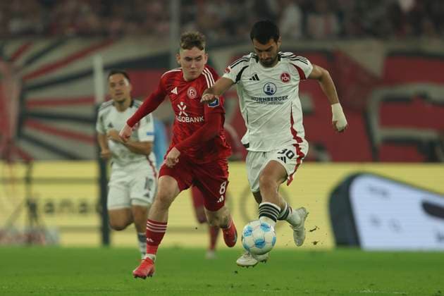 Isak Bergmann Johannesson Fortuna Duesseldorf and Mahir Emreli 1 FC Nuremberg battle for the ball during the 2 Bundesliga match between Fortuna Duesseldorf and 1 FC Nuremberg at Merkur Spiel Arena on April 26, 2025 in Duesseldorf, Germany, Germany Photo by Oliver Kaelke DeFodi Images Isak Bergmann Johannesson Fortuna Duesseldorf and Mahir Emreli 1 FC Nürnberg battle for the ball during the 2 Bundesliga match between Fortuna Düsseldorf and 1 FC Nürnberg at Merkur Spiel Arena on April 26, 2025 in Düsseldorf, Germany Photo by Oliver Kaelke DeFodi Images DFB DFL REGULATIONS PROHIBIT ANY USE OF PHOTOGRAPHS AS IMAGE SEQUENCES AND OR QUASI VIDEO Photo by Oliver Kaelke DeFodi Images
