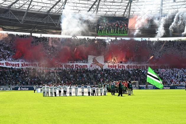 Fans 1 FC Koeln supporters use pyrotechnics during the 2 Bundesliga match between Hannover 96 and 1 FC Köln at Heinz von Heiden Arena on April 27, 2025 in Hanover, Germany Photo by Ralf Treese DeFodi Images Fans 1 FC Koeln supporters use pyrotechnics during the 2 Bundesliga match between Hannover 96 and 1 FC Köln at Heinz von Heiden Arena on April 27, 2025 in Hanover, Germany Photo by Ralf Treese DeFodi Images DFB DFL REGULATIONS PROHIBIT ANY USE OF PHOTOGRAPHS AS IMAGE SEQUENCES AND OR QUASI VIDEO Photo by Ralf Treese DeFodi Images