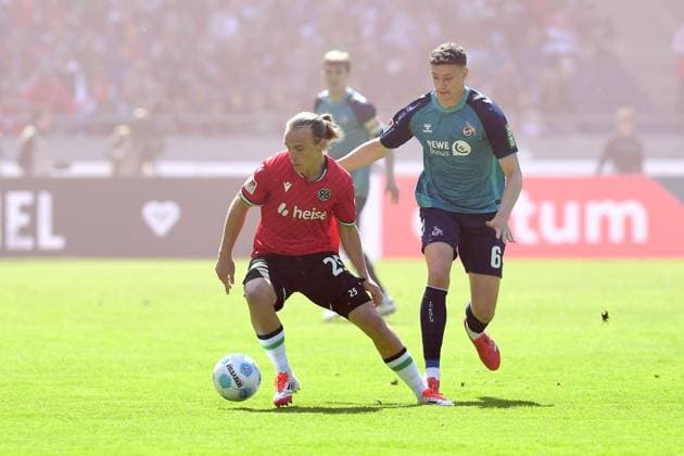 Lars Gindorf Hannover 96 and Eric Martel 1 FC Koeln battle for the ball during the 2 Bundesliga match between Hannover 96 and 1 FC Koeln at Heinz von Heiden Arena on April 27, 2025 in Hannover, Germany, Germany Photo by Ralf Treese DeFodi Images Lars Gindorf Hannover 96 and Eric Martel 1 FC Koeln battle for the ball during the 2 Bundesliga match between Hannover 96 and 1 FC Köln at Heinz von Heiden Arena on April 27, 2025 in Hanover, Germany Photo by Ralf Treese DeFodi Images DFB DFL REGULATIONS PROHIBIT ANY USE OF PHOTOGRAPHS AS IMAGE SEQUENCES AND OR QUASI VIDEO Photo by Ralf Treese DeFodi Images