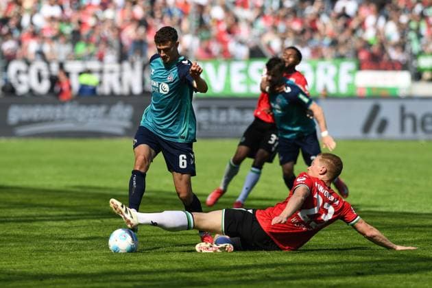 Eric Martel 1 FC Koeln and Marcel Halstenberg Hannover 96 battle for the ball during the 2 Bundesliga match between Hannover 96 and 1 FC Köln at Heinz von Heiden Arena on April 27, 2025 in Hannover, Germany, Germany Photo by Ralf Treese DeFodi Images Eric Martel 1 FC Koeln and Marcel Halstenberg Hannover 96 battle for the ball during the 2 Bundesliga match between Hannover 96 and 1 FC Köln at Heinz von Heiden Arena on April 27, 2025 in Hanover, Germany Photo by Ralf Treese DeFodi Images DFB DFL REGULATIONS PROHIBIT ANY USE OF PHOTOGRAPHS AS IMAGE SEQUENCES AND OR QUASI VIDEO Photo by Ralf Treese DeFodi Images