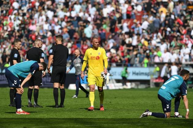Eric Martel 1 FC Koeln , Goalkeeper Marvin Schwaebe 1 FC Koeln and Dejan Ljubicic 1 FC Köln looks dejected during the 2 Bundesliga match between Hannover 96 and 1 FC Köln at Heinz von Heiden Arena on April 27, 2025 in Hannover, Germany Photo by Ralf Treese DeFodi Images Eric Martel 1 FC Koeln , Goalkeeper Marvin Schwaebe 1 FC Koeln and Dejan Ljubicic 1 FC Köln looks dejected during the 2 Bundesliga match between Hannover 96 and 1 FC Köln at Heinz von Heiden Arena on April 27, 2025 in Hanover, Germany Photo by Ralf Treese DeFodi Images DFB DFL REGULATIONS PROHIBIT ANY USE OF PHOTOGRAPHS AS IMAGE SEQUENCES AND OR QUASI VIDEO Photo by Ralf Treese DeFodi Images