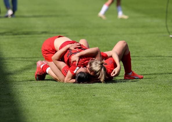Football, Women, Google Pixel Womens Bundesliga, Matchday 20, Season 2024 2025, FC Bayern Munich SC Freiburg, Campus Cheering after the final whistle to win the German championship, here Lea Schüller Schueller FC Bayern Munich on Jovana Damnjanovic FC Bayern Munich on the ground