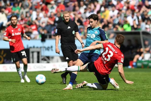 Denis Huseinbasic 1 FC Koeln and Marcel Halstenberg Hannover 96 battle for the ball during the 2 Bundesliga match between Hannover 96 and 1 FC Köln at Heinz von Heiden Arena on April 27, 2025 in Hannover, Germany Germany Photo by Ralf Treese DeFodi Images Denis Huseinbasic 1 FC Koeln and Marcel Halstenberg Hannover 96 battle for the ball during the 2 Bundesliga match between Hannover 96 and 1 FC Köln at Heinz von Heiden Arena on April 27, 2025 in Hanover, Germany Photo by Ralf Treese DeFodi Images DFB DFL REGULATIONS PROHIBIT ANY USE OF PHOTOGRAPHS AS IMAGE SEQUENCES AND OR QUASI VIDEO Photo by Ralf Treese DeFodi Images