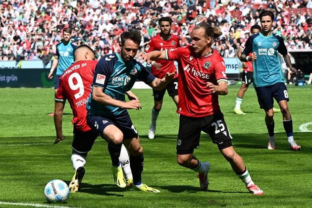Mark Uth 1 FC Koeln and Lars Gindorf Hannover 96 battle for the ball during the 2 Bundesliga match between Hannover 96 and 1 FC Köln at Heinz von Heiden Arena on April 27, 2025 in Hannover, Germany, Germany Photo by Ralf Treese DeFodi Images Mark Uth 1 FC Koeln and Lars Gindorf Hannover 96 battle for the ball during the 2 Bundesliga match between Hannover 96 and 1 FC Köln at Heinz von Heiden Arena on April 27, 2025 in Hanover, Germany Photo by Ralf Treese DeFodi Images DFB DFL REGULATIONS PROHIBIT ANY USE OF PHOTOGRAPHS AS IMAGE SEQUENCES AND OR QUASI VIDEO Photo by Ralf Treese DeFodi Images