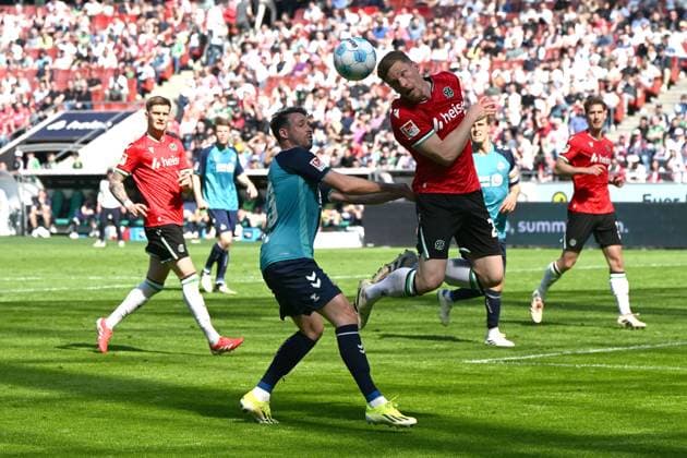 Mark Uth 1 FC Koeln and Marcel Halstenberg Hannover 96 battle for the ball during the 2 Bundesliga match between Hannover 96 and 1 FC Köln at Heinz von Heiden Arena on April 27, 2025 in Hannover, Germany, Germany Photo by Ralf Treese DeFodi Images Mark Uth 1 FC Koeln and Marcel Halstenberg Hannover 96 battle for the ball during the 2 Bundesliga match between Hannover 96 and 1 FC Köln at Heinz von Heiden Arena on April 27, 2025 in Hanover, Germany Photo by Ralf Treese DeFodi Images DFB DFL REGULATIONS PROHIBIT ANY USE OF PHOTOGRAPHS AS IMAGE SEQUENCES AND OR QUASI VIDEO Photo by Ralf Treese DeFodi Images