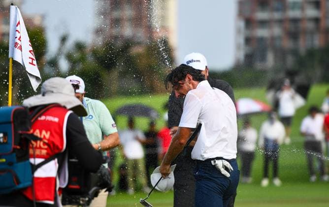 (250427) -- HAIKOU, April 27, 2025 -- Marco Penge of England (front R) celebrates after the round 4 at the Hainan Classic golf tournament of the DP World Tour in Haikou, south China s Hainan Province, April 27, 2025. ) (SP)CHINA-HAIKOU-GOLF-DP WORLD TOUR-HAINAN CLASSIC-ROUND 4 (CN) YangxGuanyu 
