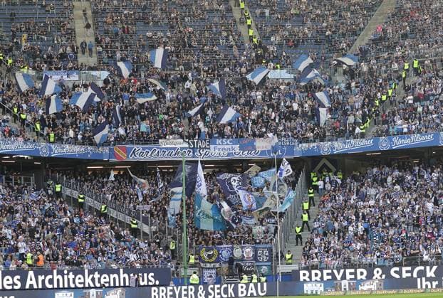 Fankurver of Karlsuher SC Football, Men, Season 2024 2025, 2 BL, Volksparkstadion, Hamburger SV vs Karlsruher SC, 1 2 DFL REGULATIONS PROHIBIT ANY USE OF PHOTOGRAPHS AS IMAGE SEQUENCES AND OR QUASI VIDEO