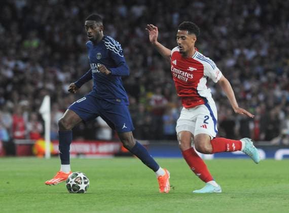 Football - 2024 2025 UEFA Champions League - Semi-Finals - First Leg - Arsenal vs Paris St Germain - Emirates Stadium - Tuesday 29th April 2025. Ousmane Dembele of PSG and William Saliba of Arsenal 