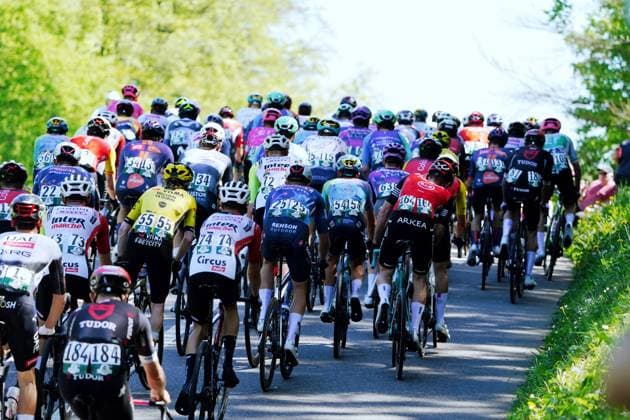 30 04 025 Cycling race Tour de Romandie 1 stage Muenchenstein Freibourg The field of riders on the climb to Hochwald SO Back view