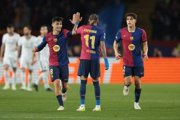 Barcelona, Spain, 30th April 2025. Pedri and Pau Cubarsi of FC Barcelona, Barca celebrate with team mate Raphinha after Yann Sommer of FC Internazionale conceeded an own goal to level the tie at 3-3 during the FC Barcelona vs Internazionale UEFA Champions League match at Estadi Olimpic Luis Companys, Barcelona. Picture credit should read: Jonathan Moscrop Sportimage EDITORIAL USE ONLY. No use with unauthorised audio, video, data, fixture lists, club league logos or live services. Online in-match use limited to 120 images, no video emulation. No use in betting, games or single club league player publications. SPI_034_JM_BARCA_INTER_ SPI-3882-0034