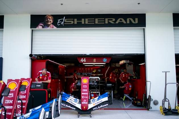 A sign for Ed Sheeran is seen over the Scuderia Ferrari garage during the Formula One Miami Grand Prix at the Miami International Autodrome in Miami Gardens, Florida on Thursday, May 1, 2025.  MIA2025050130 GREGxNASH