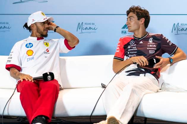 British Formula One driver Lewis Hamilton of Scuderia Ferrari speaks with British Formula One driver George Russell of Mercedes-AMG Petronas at a press conference, PK, Pressekonferenz during the Formula One Miami Grand Prix at the Miami International Autodrome in Miami Gardens, Florida on Thursday, May 1, 2025.  MIA2025050123 GREGxNASH