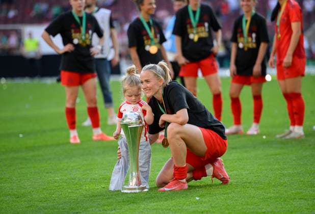 Lea SCHUELLER Schüller M with the trophy and child, DFB Pokal Final Women 2025, FC Bayern Muenchen M SV Werder Bremen HB 4 2, am 01 05 2025 in Koeln Germany DFB regulations prohibit any use of photographs as image sequences and or quasi video Â
