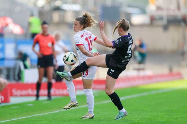 Nia Szenk SC Freiburg and Paula Flach SGS Essen battle for the ball, Google Pixel Frauen Bundesliga, SGS Essen vs SC Freiburg, Stadion an der Hafenstrasse, May 2, 2025 in Essen, Germany Photo by Marco Steinbrenner DeFodi Images Nia Szenk SC Freiburg and Paula Flach SGS Essen battle for the ball, Google Pixel Womens Bundesliga, SGS Essen vs SC Freiburg, Stadion an der Hafenstrasse, May 2, 2025 in Essen, Germany Photo by Marco Steinbrenner DeFodi Images DFB DFL REGULATIONS PROHIBIT ANY USE OF PHOTOGRAPHS AS IMAGE SEQUENCES AND OR QUASI VIDEO