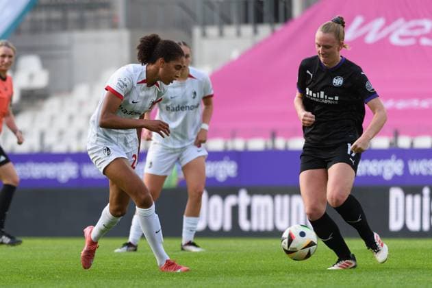 Cora Zicai (28 SC Freiburg) and Annalena Rieke (17 SGS Essen) during the Google Pixel Frauen Bundesliga match between SGS Essen and SC Freiburg at Stadion an der Hafenstrasse, Essen, Germany. (Sven Beyrich SPP) Copyright: xSvenxBeyrich SPPx spp-en-SvBe-20250502-D4S_0699