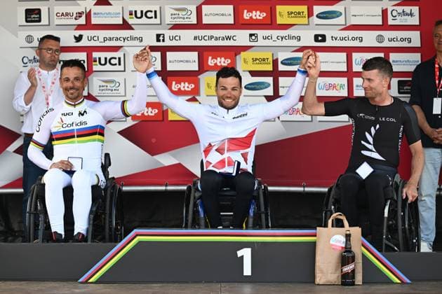 L-R, second MH2 Spain s Sergio Garrote Munoz, winner MH2 France s Florian Jouanny and third MH2 New Zealand s Rory Mead celebrate on the podium of the MH2 at the road races at the UCI Para-Cycling Road World Cup event, Saturday 03 May 2025, in Brugge. The UCI Para-Cycling Road World Cup takes place from 01 to 04 May in Oostende and Brugge. LUCxCLAESSEN  x122529525x