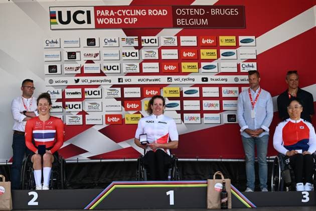 L-R, second WH4 Norway s Suzanna Tangen, winner WH4 Switzerland s Sandra Fuhrer and third WH4 South Korea s Doyeon Lee celebrate on the podium at the road races at the UCI Para-Cycling Road World Cup event, Saturday 03 May 2025, in Brugge. The UCI Para-Cycling Road World Cup takes place from 01 to 04 May in Oostende and Brugge. LUCxCLAESSEN  x122532312x