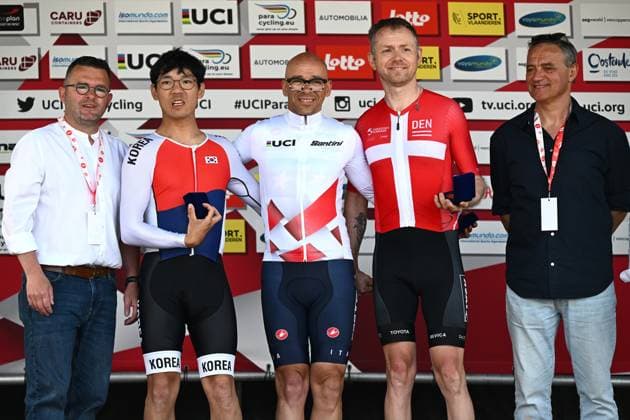 L-R, second MT1 South Korea s Junyoung Park, winner MT1 Italy s Giorgio Farroni and third MT1 Denmark s Martin Heggelund celebrate on the podium of the road races at the UCI Para-Cycling Road World Cup event, Saturday 03 May 2025, in Brugge. The UCI Para-Cycling Road World Cup takes place from 01 to 04 May in Oostende and Brugge. LUCxCLAESSEN  x122532791x