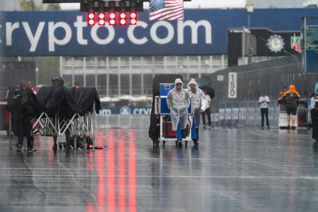 Crews prepare for a wet sprint race of at the Formula One Miami Grand Prix at the Miami International Autodrome in Miami Gardens, Florida on Saturday, May 3, 2025.  MIA2025050324 GREGxNASH