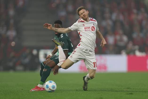 Florian Kainz 1 FC Koeln and Frederic Ananou SSV Jahn Regensburg battle for the ball during the 2 Bundesliga match between 1 FC Koeln and Jahn Regensburg at RheinEnergieStadion on May 03, 2025 in Cologne, Germany, Germany Photo by Oliver Kaelke DeFodi Images Florian Kainz 1 FC Koeln and Frederic Ananou SSV Jahn Regensburg battle for the ball during the 2 Bundesliga match between 1 FC Köln and Jahn Regensburg at RheinEnergieStadion on May 3, 2025 in Cologne, Germany Photo by Oliver Kaelke DeFodi Images DFB DFL REGULATIONS PROHIBIT ANY USE OF PHOTOGRAPHS AS IMAGE SEQUENCES AND OR QUASI VIDEO Photo by Oliver Kaelke DeFodi Images