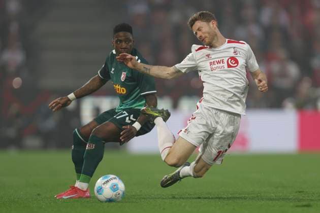 Florian Kainz 1 FC Koeln and Frederic Ananou SSV Jahn Regensburg battle for the ball during the 2 Bundesliga match between 1 FC Koeln and Jahn Regensburg at RheinEnergieStadion on May 03, 2025 in Cologne, Germany, Germany Photo by Oliver Kaelke DeFodi Images Florian Kainz 1 FC Koeln and Frederic Ananou SSV Jahn Regensburg battle for the ball during the 2 Bundesliga match between 1 FC Köln and Jahn Regensburg at RheinEnergieStadion on May 3, 2025 in Cologne, Germany Photo by Oliver Kaelke DeFodi Images DFB DFL REGULATIONS PROHIBIT ANY USE OF PHOTOGRAPHS AS IMAGE SEQUENCES AND OR QUASI VIDEO Photo by Oliver Kaelke DeFodi Images