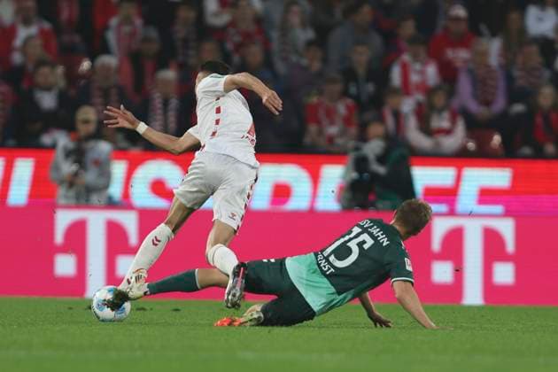 Dejan Ljubicic 1 FC Koeln and Sebastian Ernst SSV Jahn Regensburg battle for the ball during the 2 Bundesliga match between 1 FC Koeln and Jahn Regensburg at RheinEnergieStadion on May 03, 2025 in Cologne, Germany, Germany Photo by Oliver Kaelke DeFodi Images Dejan Ljubicic 1 FC Koeln and Sebastian Ernst SSV Jahn Regensburg battle for the ball during the 2 Bundesliga match between 1 FC Köln and Jahn Regensburg at RheinEnergieStadion on May 3, 2025 in Cologne, Germany Photo by Oliver Kaelke DeFodi Images DFB DFL REGULATIONS PROHIBIT ANY USE OF PHOTOGRAPHS AS IMAGE SEQUENCES AND OR QUASI VIDEO Photo by Oliver Kaelke DeFodi Images