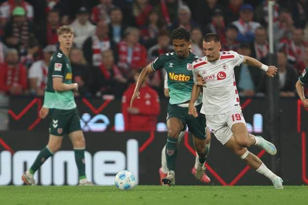 Bryan Hein SSV Jahn Regensburg and Tim Lemperle 1 FC Koeln battle for the ball during the 2 Bundesliga match between 1 FC Köln and Jahn Regensburg at RheinEnergieStadion on May 03, 2025 in Cologne, Germany, Germany Photo by Oliver Kaelke DeFodi Images Bryan Hein SSV Jahn Regensburg and Tim Lemperle 1 FC Koeln battle for the ball during the 2 Bundesliga match between 1 FC Köln and Jahn Regensburg at RheinEnergieStadion on May 3, 2025 in Cologne, Germany Photo by Oliver Kaelke DeFodi Images DFB DFL REGULATIONS PROHIBIT ANY USE OF PHOTOGRAPHS AS IMAGE SEQUENCES AND OR QUASI VIDEO Photo by Oliver Kaelke DeFodi Images