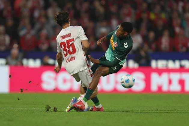 Max Finkgraefe 1 FC Koeln and Noah Ganaus SSV Jahn Regensburg battle for the ball during the 2 Bundesliga match between 1 FC Koeln and Jahn Regensburg at RheinEnergieStadion on May 03, 2025 in Cologne, Germany, Germany Photo by Oliver Kaelke DeFodi Images Max Finkgraefe 1 FC Koeln and Noah Ganaus SSV Jahn Regensburg battle for the ball during the 2 Bundesliga match between 1 FC Köln and Jahn Regensburg at RheinEnergieStadion on May 3, 2025 in Cologne, Germany Photo by Oliver Kaelke DeFodi Images DFB DFL REGULATIONS PROHIBIT ANY USE OF PHOTOGRAPHS AS IMAGE SEQUENCES AND OR QUASI VIDEO Photo by Oliver Kaelke DeFodi Images