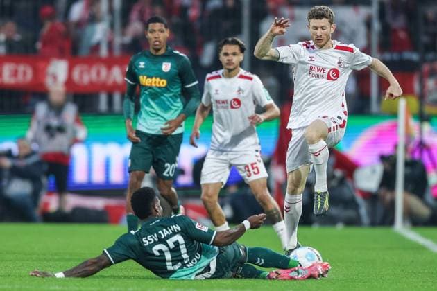 Soccer 2 Bundesliga 32 Matchday 1 FC Köln SSV Jahn Regensburg on 03 05 2025 at RheinEnergieStadion in Cologne Frederic Ananou Regensburg , front Florian Kainz Köln , back DFL regulations prohibit any use of photographs as image sequences and or quasi video xJRx