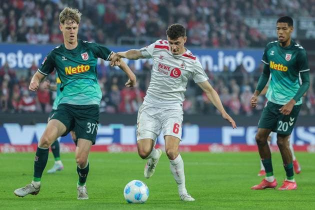 Soccer 2 Bundesliga 32 Matchday 1 FC Köln SSV Jahn Regensburg on 03 05 2025 at RheinEnergieStadion in Cologne Leopold Wurm Regensburg , left Eric Martel Köln , right DFL regulations prohibit any use of photographs as image sequences and or quasi video xJRx