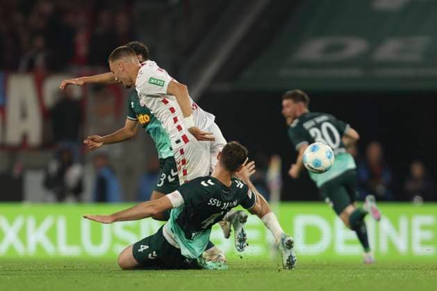 Florian Ballas SSV Jahn Regensburg and Tim Lemperle 1 FC Koeln battle for the ball during the 2 Bundesliga match between 1 FC Köln and Jahn Regensburg at RheinEnergieStadion on May 03, 2025 in Cologne, Germany, Germany Photo by Oliver Kaelke DeFodi Images Florian Ballas SSV Jahn Regensburg and Tim Lemperle 1 FC Koeln battle for the ball during the 2 Bundesliga match between 1 FC Köln and Jahn Regensburg at RheinEnergieStadion on May 3, 2025 in Cologne, Germany Photo by Oliver Kaelke DeFodi Images DFB DFL REGULATIONS PROHIBIT ANY USE OF PHOTOGRAPHS AS IMAGE SEQUENCES AND OR QUASI VIDEO Photo by Oliver Kaelke DeFodi Images