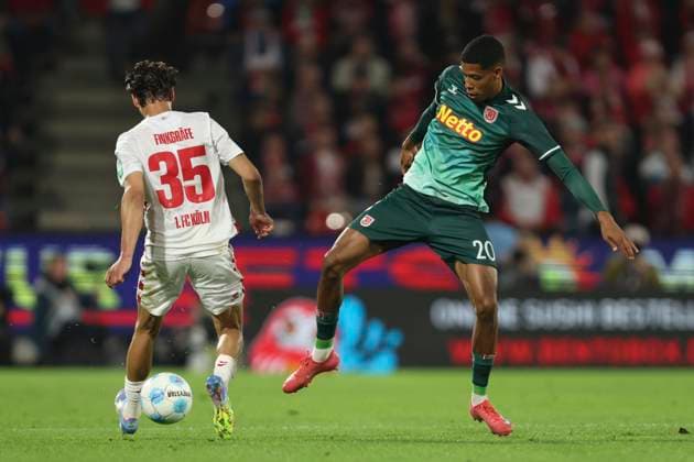 Max Finkgraefe 1 FC Koeln and Noah Ganaus SSV Jahn Regensburg battle for the ball during the 2 Bundesliga match between 1 FC Koeln and Jahn Regensburg at RheinEnergieStadion on May 03, 2025 in Cologne, Germany, Germany Photo by Oliver Kaelke DeFodi Images Max Finkgraefe 1 FC Koeln and Noah Ganaus SSV Jahn Regensburg battle for the ball during the 2 Bundesliga match between 1 FC Köln and Jahn Regensburg at RheinEnergieStadion on May 3, 2025 in Cologne, Germany Photo by Oliver Kaelke DeFodi Images DFB DFL REGULATIONS PROHIBIT ANY USE OF PHOTOGRAPHS AS IMAGE SEQUENCES AND OR QUASI VIDEO Photo by Oliver Kaelke DeFodi Images