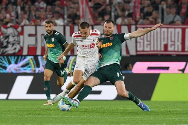 Tim Lemperle 1 FC Koeln and Florian Ballas Jahn Regensburg battle for the ball during the 2 Bundesliga match between 1 FC Köln and Jahn Regensburg at RheinEnergieStadion on May 03, 2025 in Cologne, Germany Photo by Ralf Treese DeFodi Images Tim Lemperle 1 FC Koeln and Florian Ballas Jahn Regensburg battle for the ball during the 2 Bundesliga match between 1 FC Köln and Jahn Regensburg at RheinEnergieStadion on May 3, 2025 in Cologne, Germany Photo by Ralf Treese DeFodi Images DFB DFL REGULATIONS PROHIBIT ANY USE OF PHOTOGRAPHS AS IMAGE SEQUENCES AND OR QUASI VIDEO Photo by Ralf Treese DeFodi Images