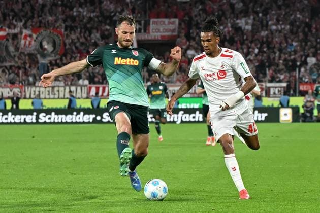Florian Ballas Jahn Regensburg and Damion Downs 1 FC Koeln battle for the ball during the 2 Bundesliga match between 1 FC Köln and Jahn Regensburg at RheinEnergieStadion on May 03, 2025 in Cologne, Germany, Germany Photo by Ralf Treese DeFodi Images Florian Ballas Jahn Regensburg and Damion Downs 1 FC Koeln battle for the ball during the 2 Bundesliga match between 1 FC Köln and Jahn Regensburg at RheinEnergieStadion on May 3, 2025 in Cologne, Germany Photo by Ralf Treese DeFodi Images DFB DFL REGULATIONS PROHIBIT ANY USE OF PHOTOGRAPHS AS IMAGE SEQUENCES AND OR QUASI VIDEO Photo by Ralf Treese DeFodi Images