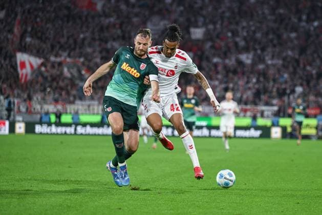 03 05 2025, Soccer, 2 Bundesliga, 32 Matchday Season 2024 2025, 1 FC Köln Jahn Regensburg, Florian Ballas SSV Jahn Regensburg , Damion Downs 1 FC Köln xRHR FOTO TKx Copyright: RHR-FOTOx RHR-FOTO TK