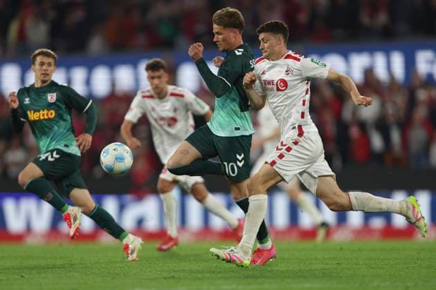 Christian Viet SSV Jahn Regensburg and Eric Martel 1 FC Koeln battle for the ball during the 2 Bundesliga match between 1 FC Köln and Jahn Regensburg at RheinEnergieStadion on May 03, 2025 in Cologne, Germany, Germany Photo by Oliver Kaelke DeFodi Images Christian Viet SSV Jahn Regensburg and Eric Martel 1 FC Koeln battle for the ball during the 2 Bundesliga match between 1 FC Köln and Jahn Regensburg at RheinEnergieStadion on May 3, 2025 in Cologne, Germany Photo by Oliver Kaelke DeFodi Images DFB DFL REGULATIONS PROHIBIT ANY USE OF PHOTOGRAPHS AS IMAGE SEQUENCES AND OR QUASI VIDEO Photo by Oliver Kaelke DeFodi Images
