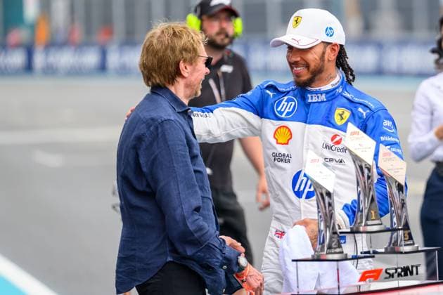 3rd May 2025; Miami International Autodrome, Miami, Florida, USA; Formula 1 Crypto.com Miami Grand Prix 2025; Sprint Race during Qualifying Day; Ferrari driver Lewis Hamilton of the United Kingdom hugs American film producer Jerry Bruckheimer.  ActionPlus12781885 DouglasxMurray